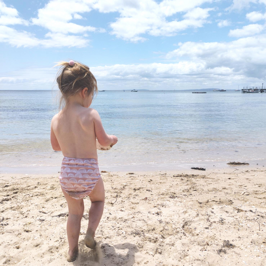 Reusable swim nappy, blush with white rainbows