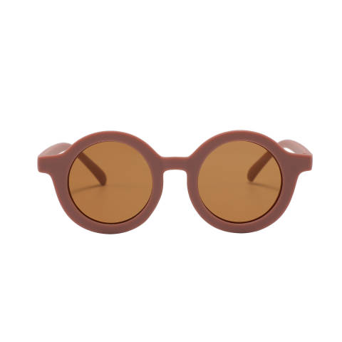 Kids fashion sunglasses with a round shape frame, matte finish in light brown