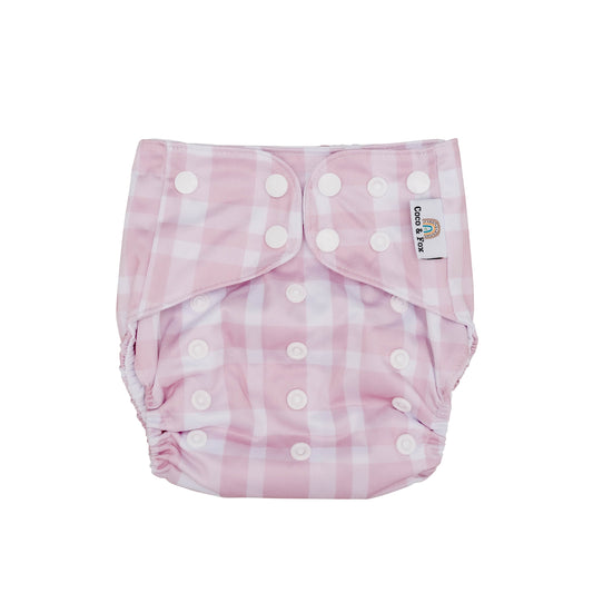 Baby reusable swim nappy.  Pink and white gingham pattern. Size is adjustable to fit newborn to toddler.